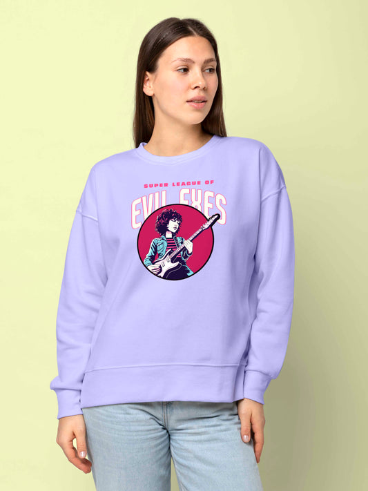 Model wearing a stylnova light purple sweatshirt with a graphic design on it. The graphic on the stylnova light purple sweatshirt features text that reads “SUPER LEAGUE OF EVIL EXES” and an illustration of a character holding an electric guitar, surrounded by a circular background. The character in the illustration has dark hair and wears clothing that matches the color of the sweatshirt.